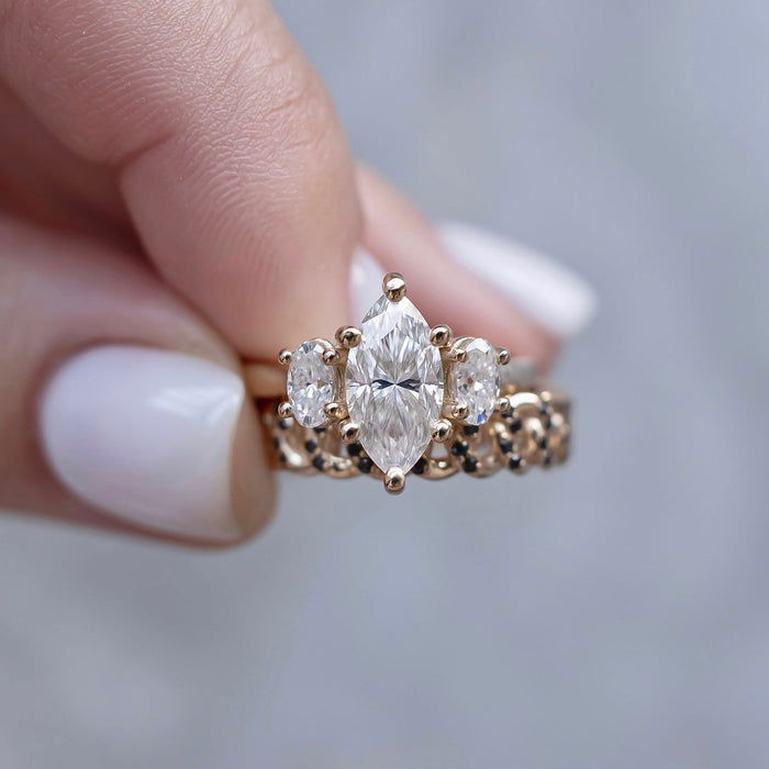 Marquise cut moissanite petite three stone engagement ring with pear side stones in yellow gold, view 2