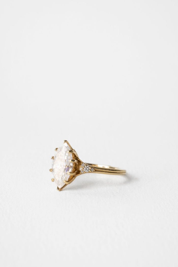 Marquise moissanite engagement ring with round cluster shoulders in yellow gold, view 2