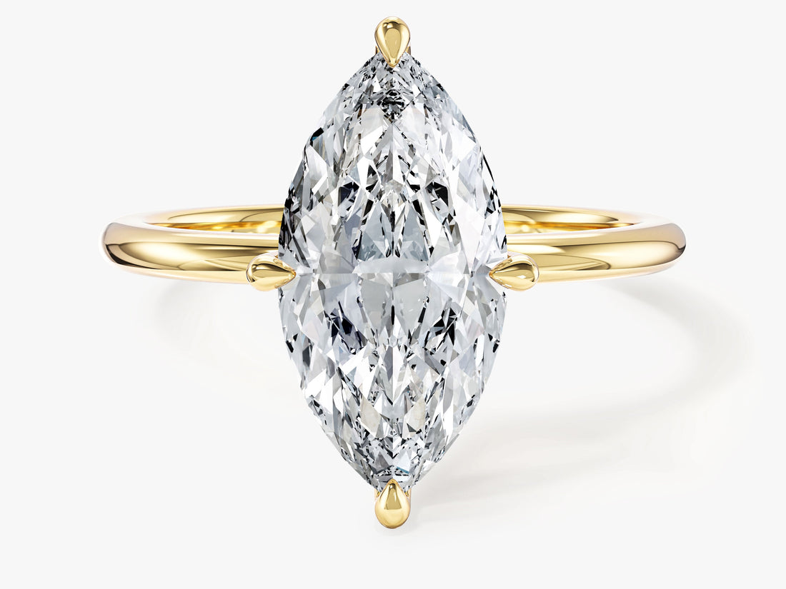 Marquise cut moissanite four prong solitaire engagement ring in yellow gold, front view