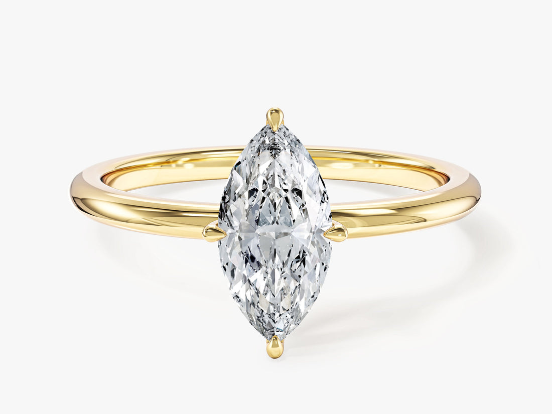 Dainty marquise moissanite minimalist solitaire engagement ring in yellow gold, front view