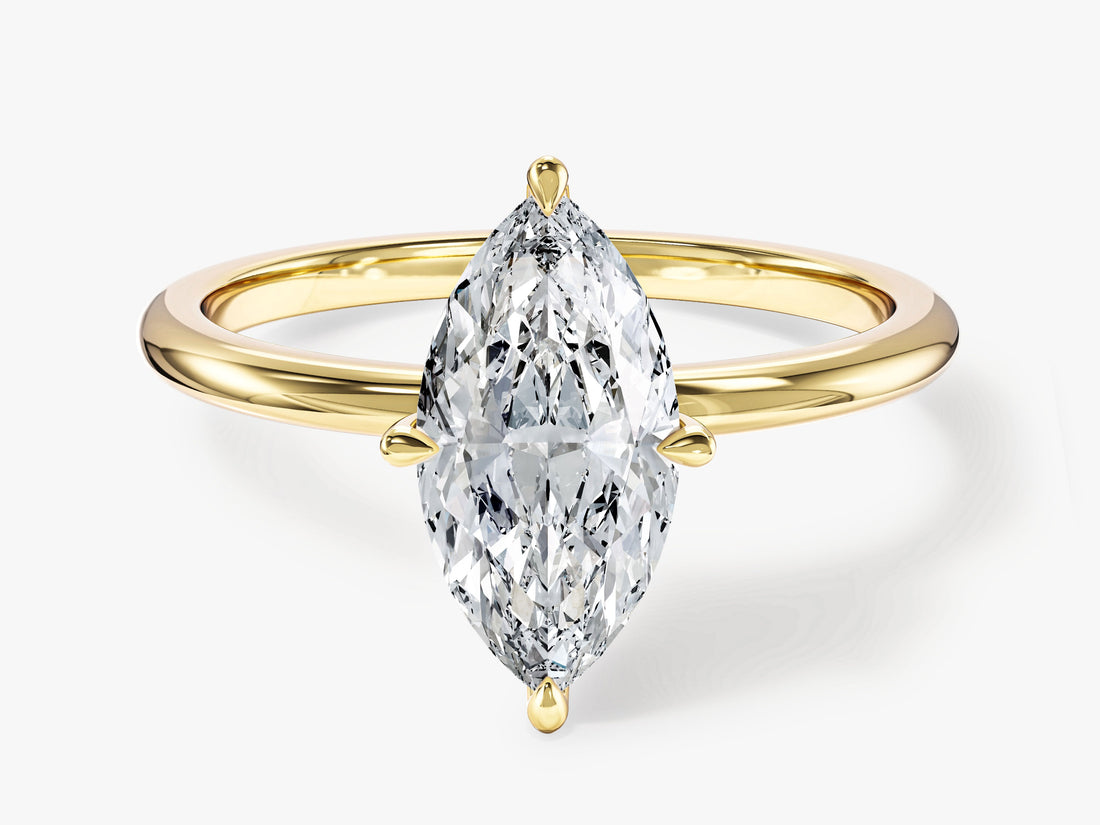 Elongated marquise moissanite north south solitaire engagement ring in yellow gold, front view