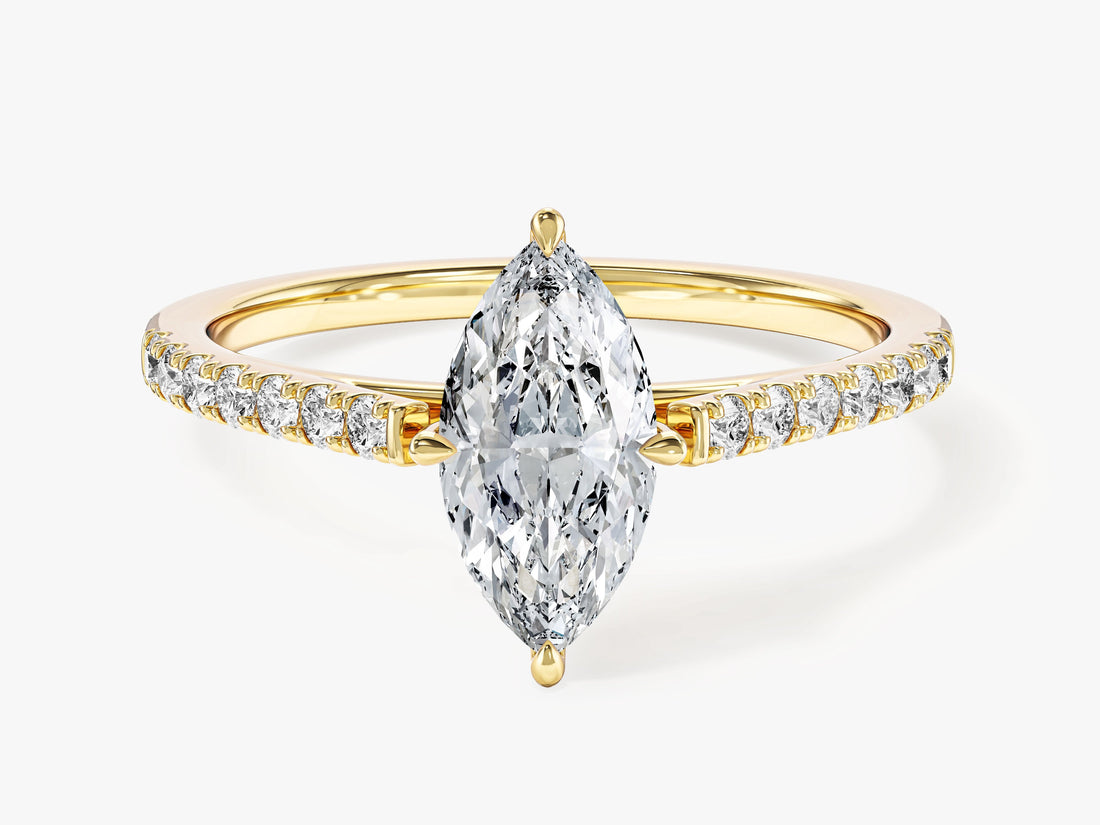 Dainty marquise moissanite engagement ring with pave set side stones in 14K yellow gold, front view