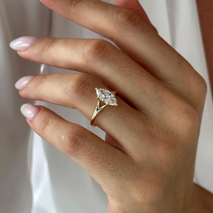 Marquise cut moissanite split shank solitaire engagement ring in yellow gold, view 2