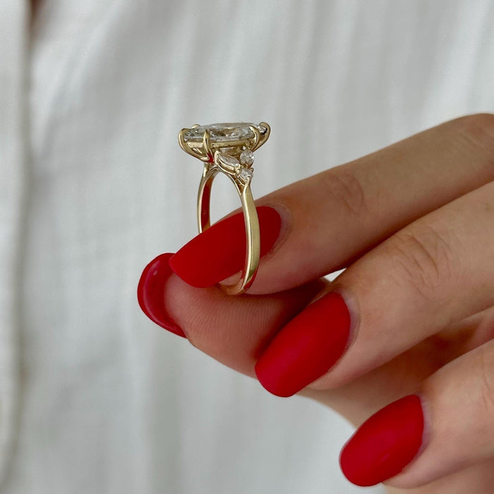 Marquise cut moissanite star cluster engagement ring in yellow gold, view 2