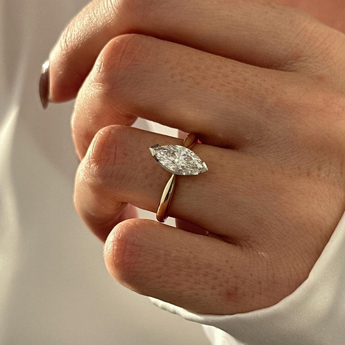Marquise cut moissanite two tone solitaire engagement ring in white and yellow gold, view 2