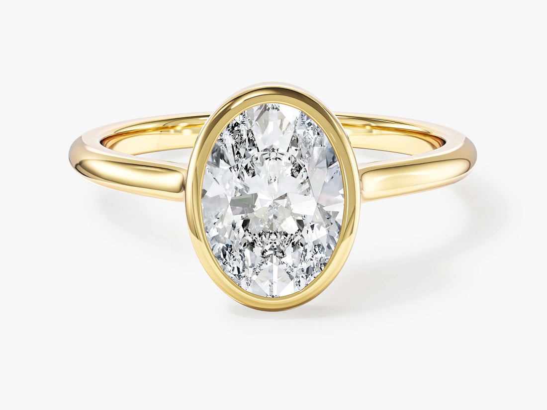Minimalist oval moissanite bezel setting engagement ring in yellow gold, front view