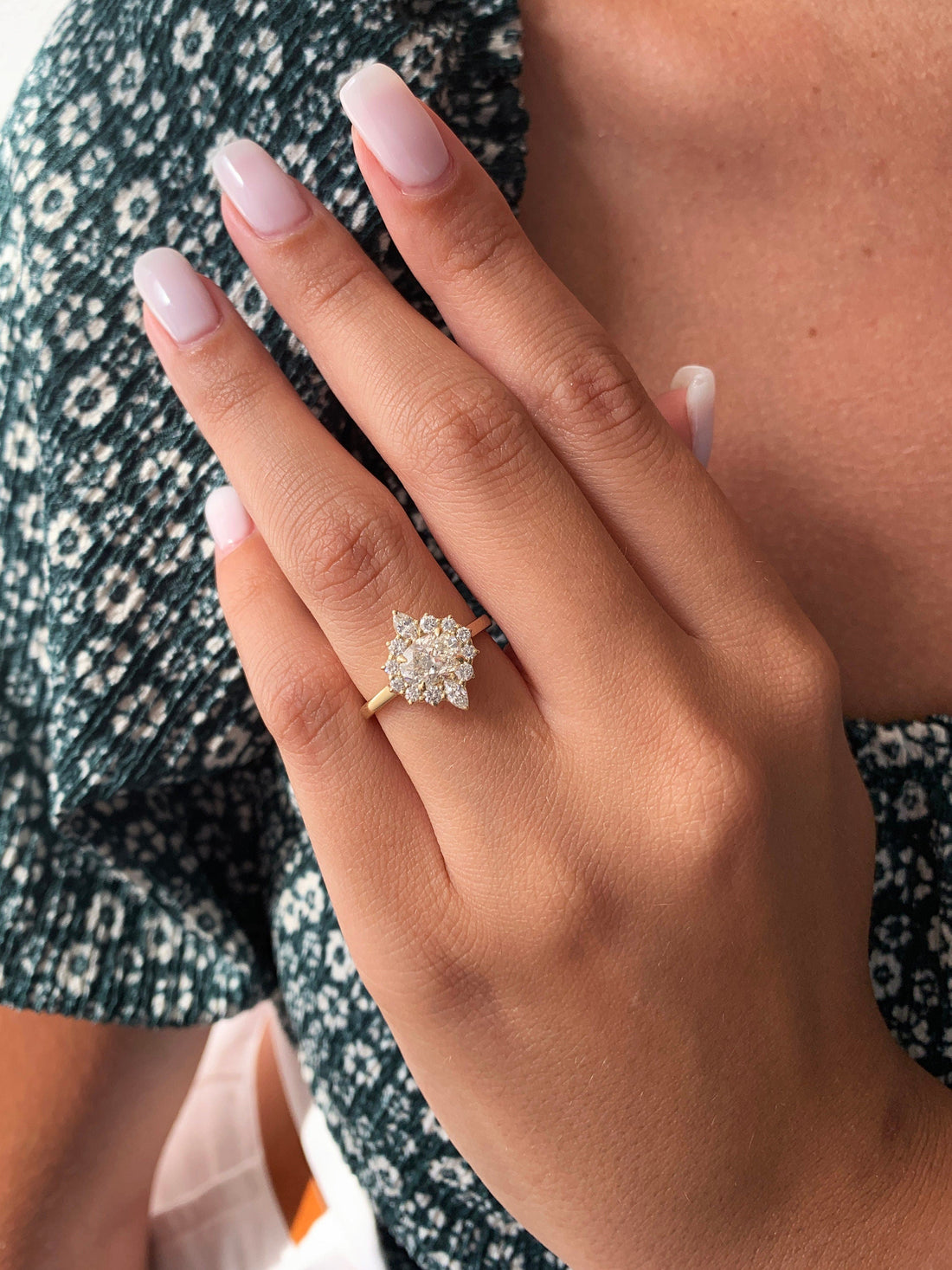 Oval cut moissanite mixed cut cluster engagement ring in yellow gold