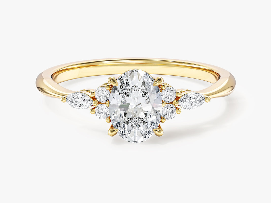 Vintage style oval moissanite engagement ring with marquise and round accents in yellow gold, front view