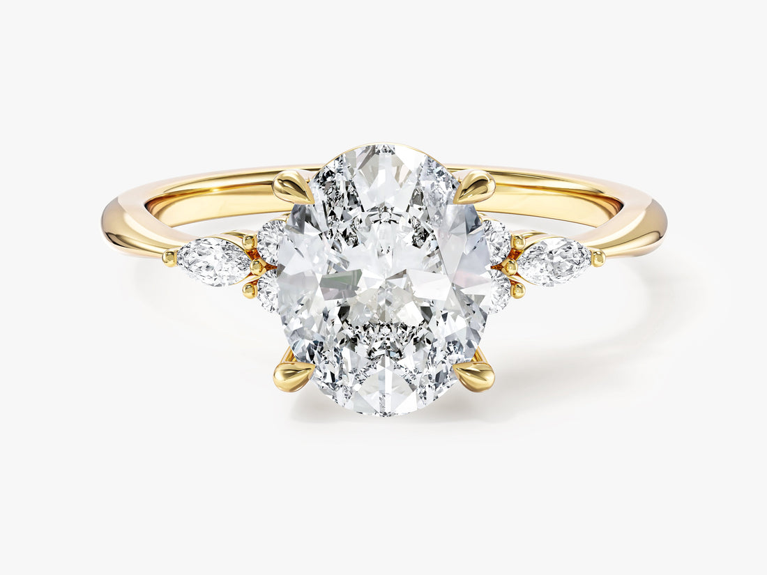 Oval cut moissanite cluster engagement ring with marquise side stones in yellow gold, front view