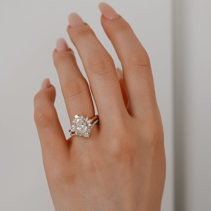 Oval cut moissanite crown cluster engagement ring in rose gold
