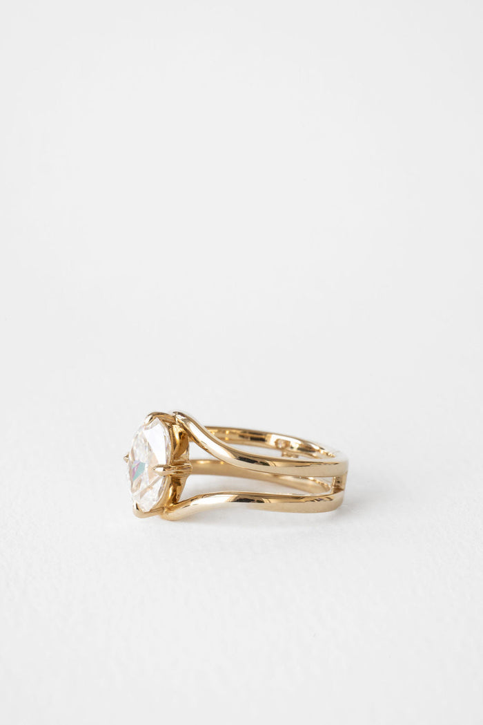 Oval cut moissanite double curved rail solitaire engagement ring in yellow gold, view 2
