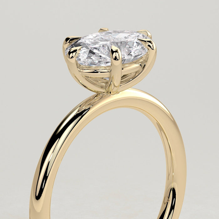 East west oval moissanite six claw solitaire engagement ring on a plain yellow gold band, view 2