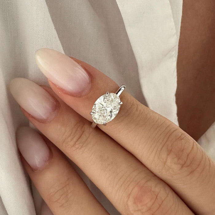 East west oval cut moissanite solitaire engagement ring in white gold, view 2