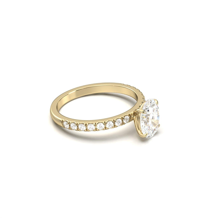 Oval cut moissanite four claw engagement ring on a French pave shank in yellow gold, view 2