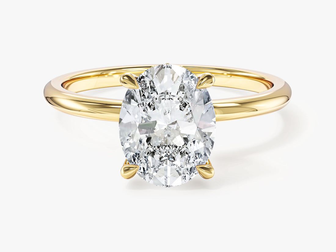 Oval cut moissanite hidden halo engagement ring with plain band in yellow gold, front view