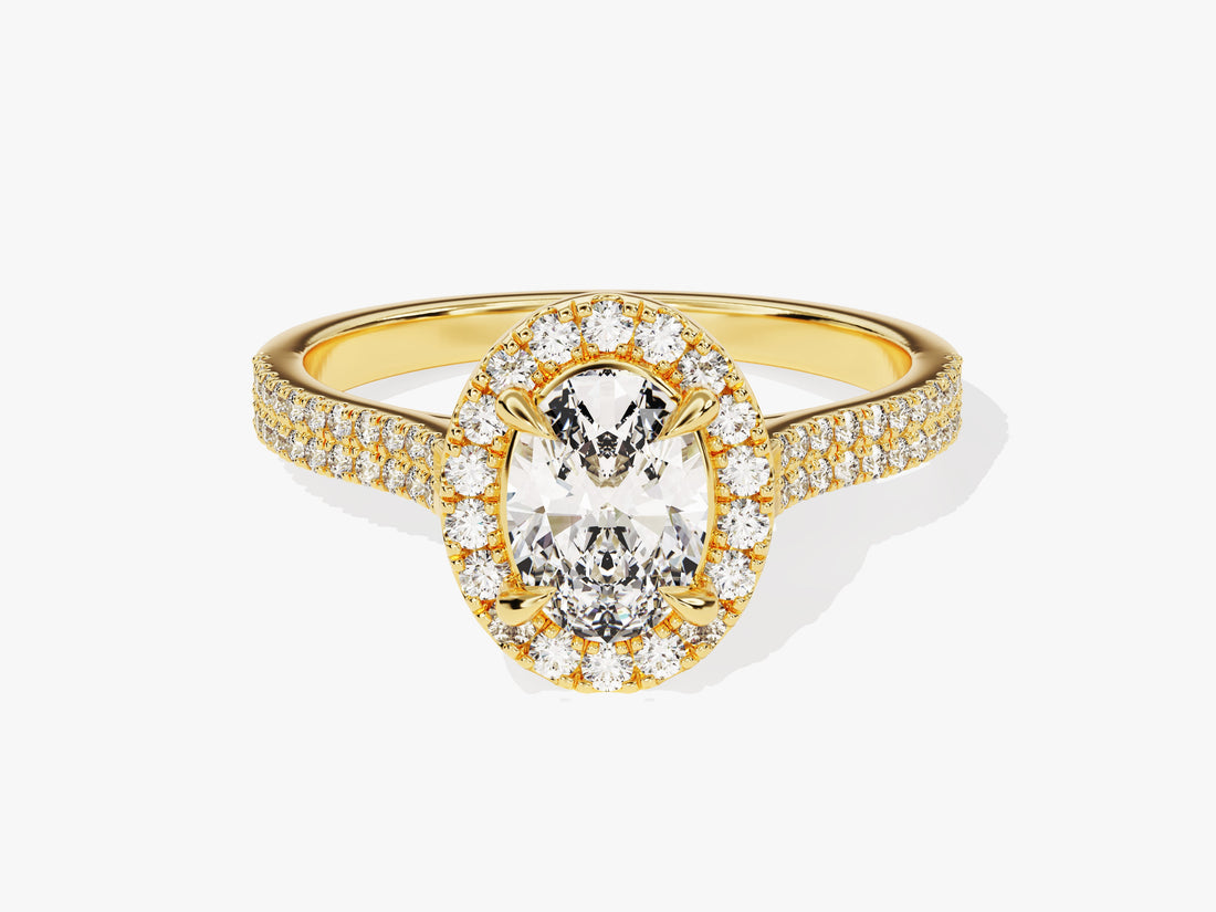 Petite oval halo moissanite engagement ring with double pave shank in yellow gold, front view