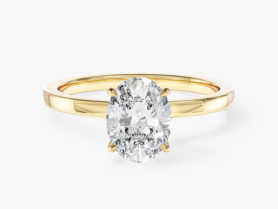 Oval moissanite hidden halo solitaire engagement ring with flat plain band in 14K yellow gold, front view