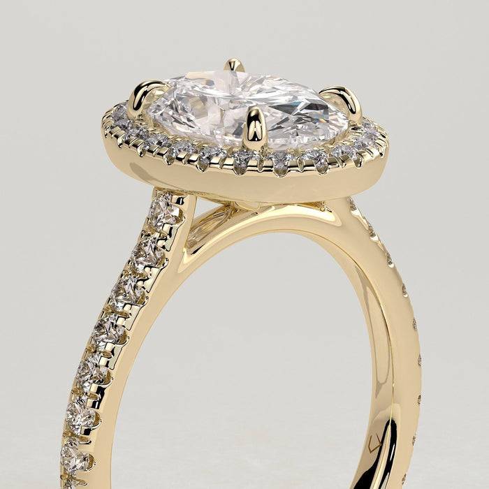 Oval cut moissanite halo engagement ring on a pave yellow gold band, view 2