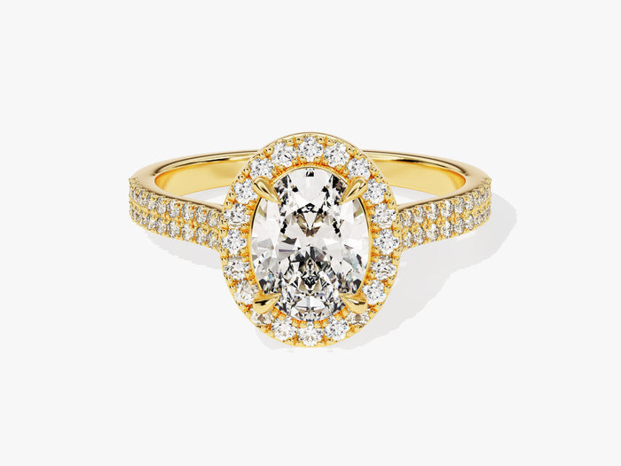 Oval cut lab grown diamond halo engagement ring with two row micro pave shank in yellow gold, front view