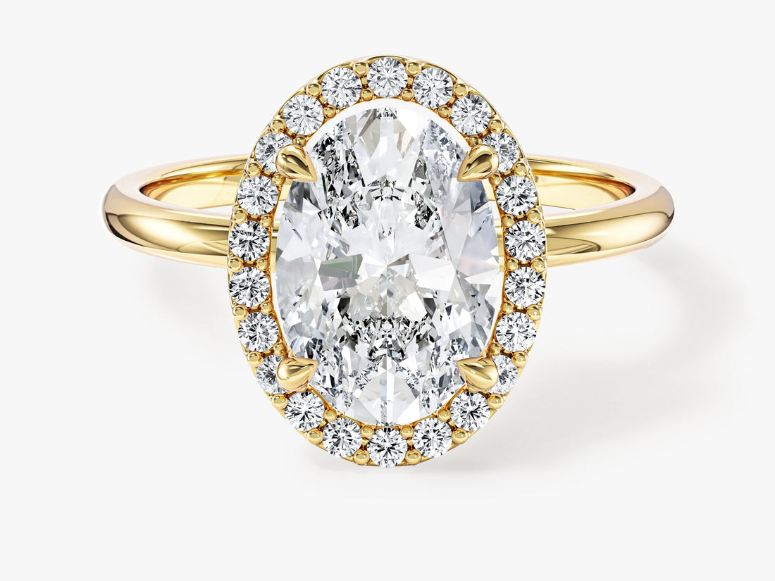 Oval lab grown diamond micro pave halo engagement ring in yellow gold, front view
