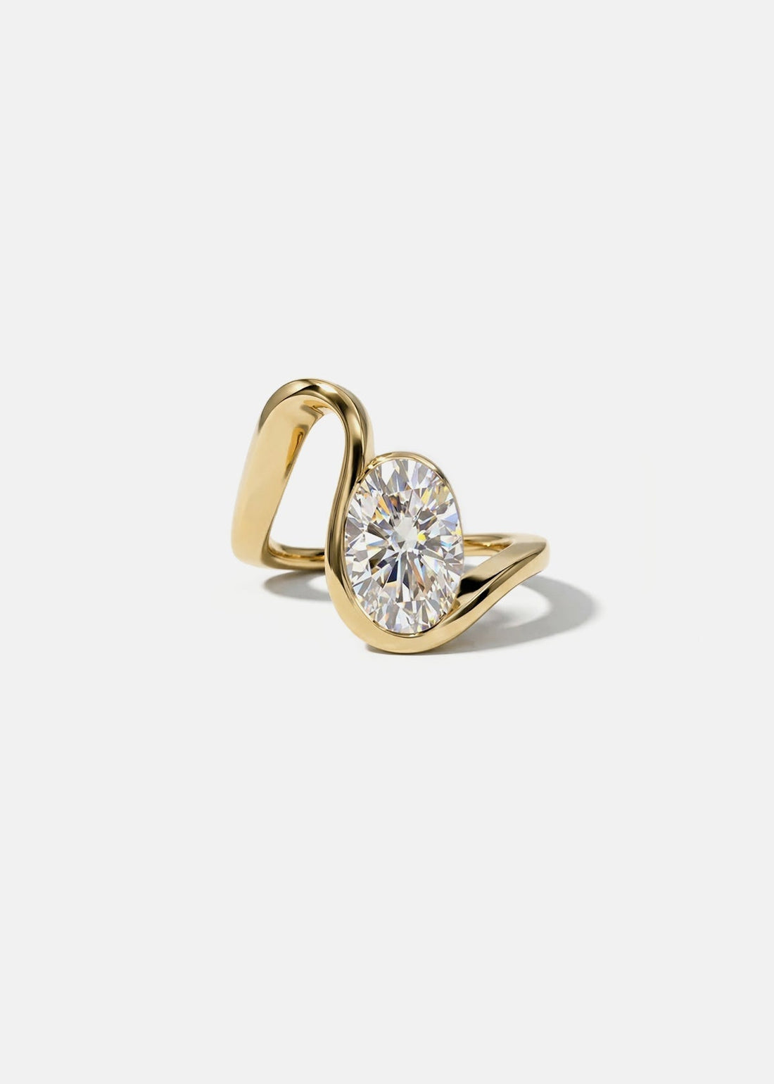 Oval cut moissanite open loop half bezel engagement ring in yellow gold