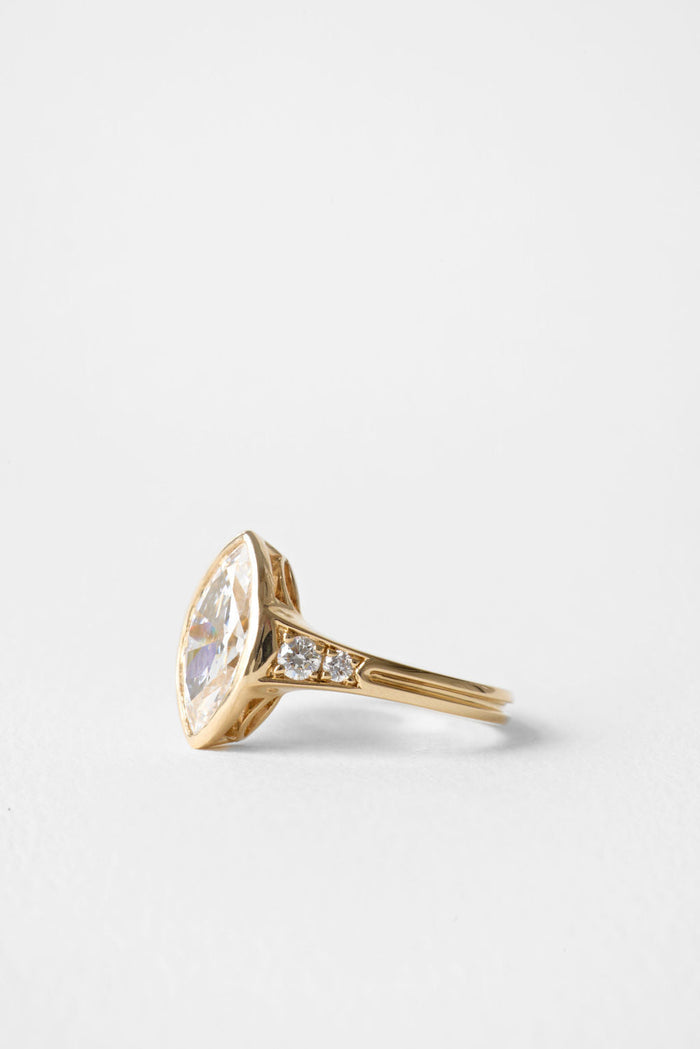 Old mine marquise moissanite bezel engagement ring with pave shoulders in yellow gold, view 2