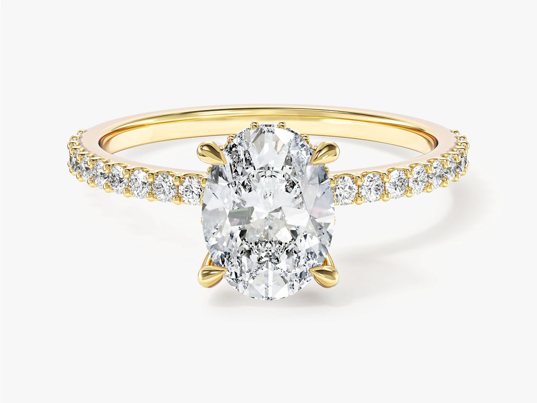 Oval lab grown diamond pave engagement ring with hidden diamond halo in yellow gold, front view