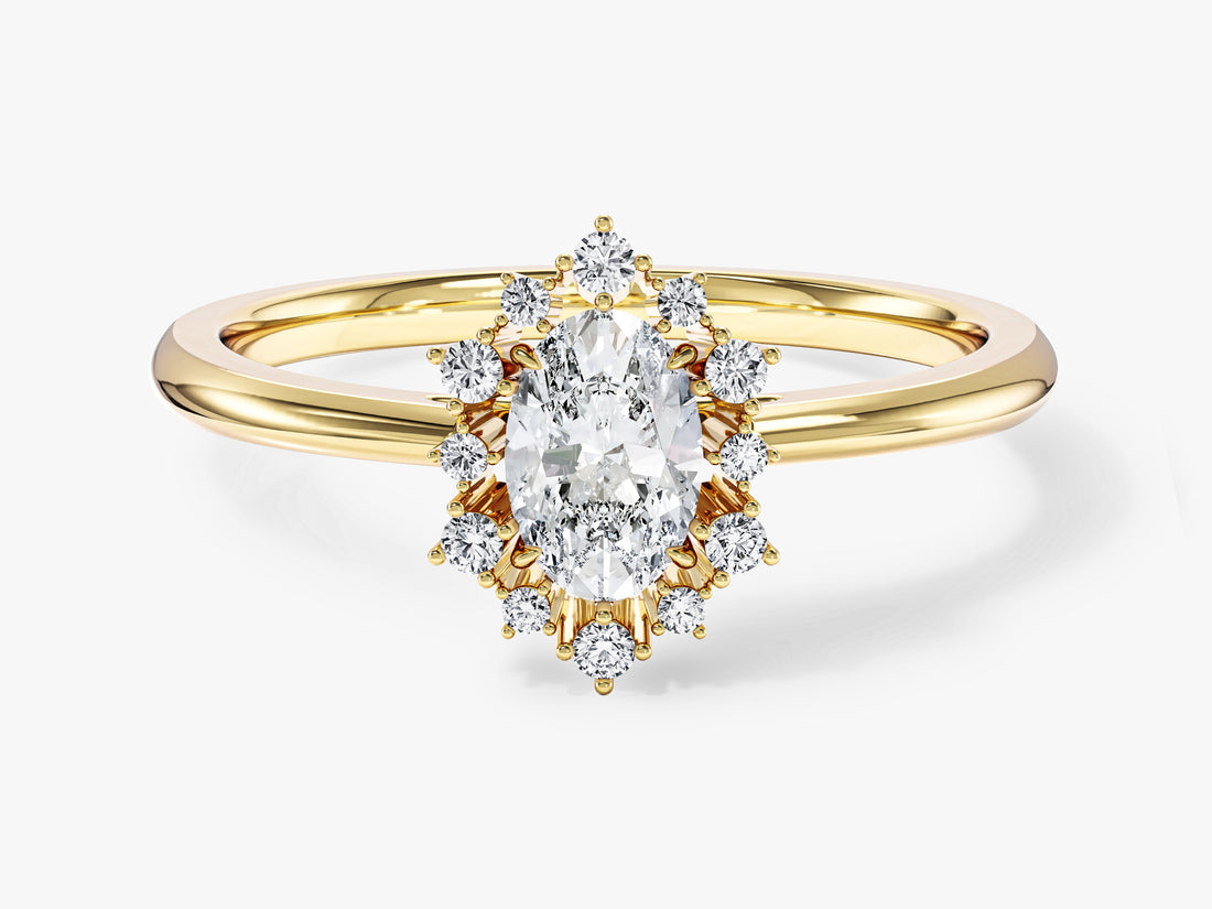 Oval moissanite sunburst halo engagement ring on a thin band in yellow gold, front view