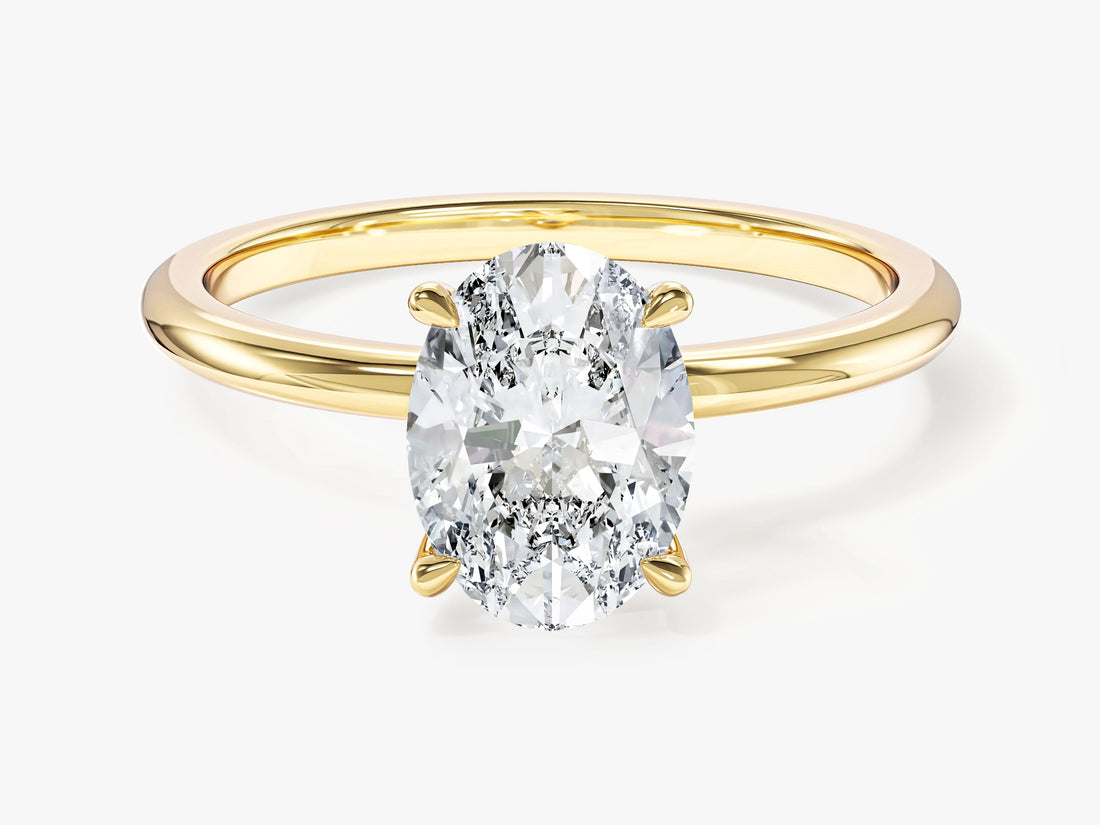 Minimalist oval lab grown diamond solitaire engagement ring in yellow gold, front view