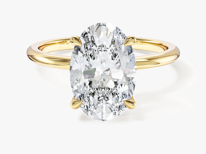 Large oval moissanite four prong solitaire engagement ring in yellow gold, front view