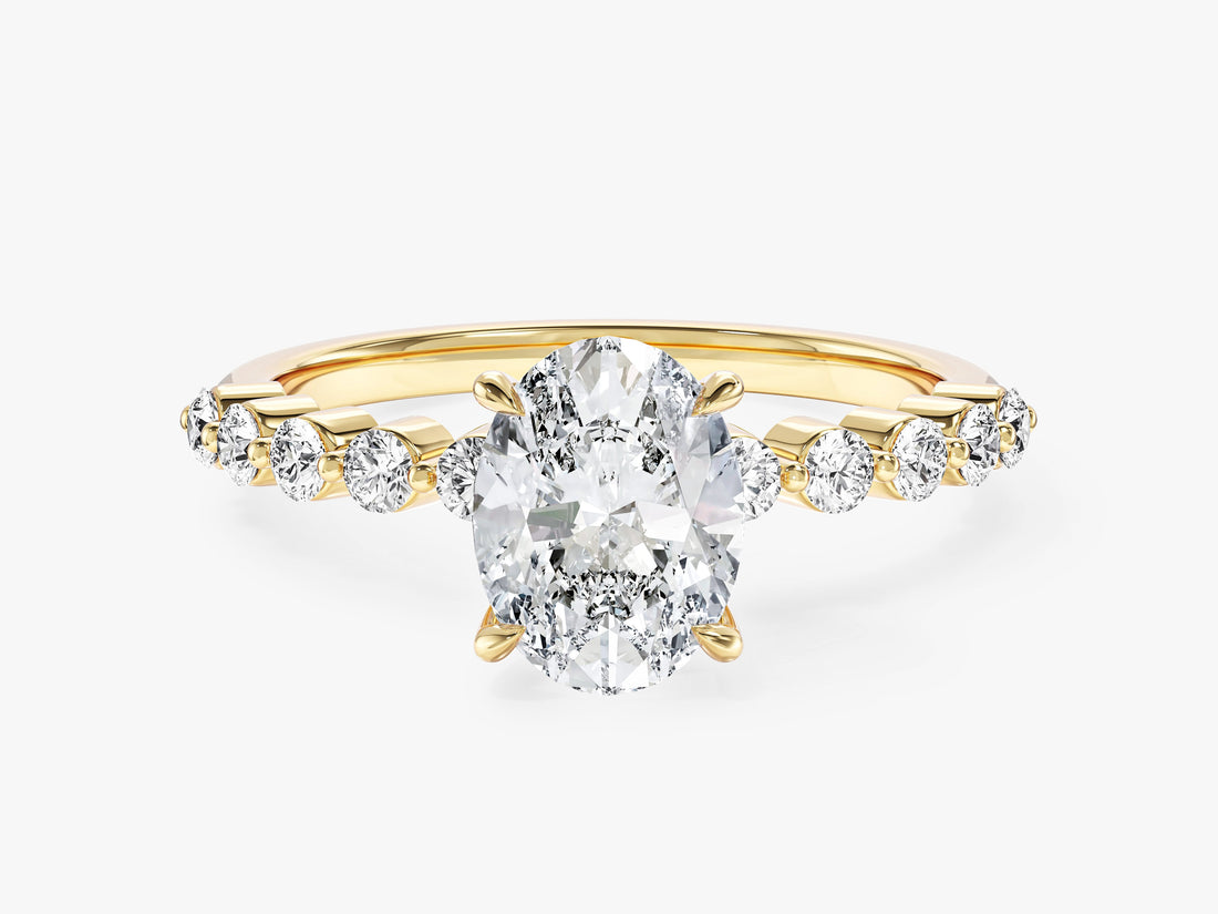 Oval moissanite engagement ring with shared prong round side stones in 14K yellow gold, front view