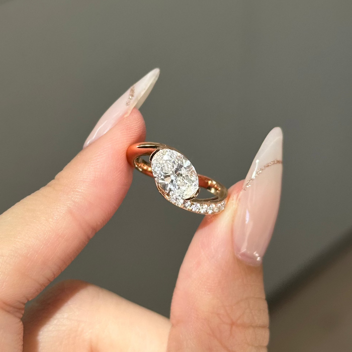 Oval cut moissanite swirl pave bypass engagement ring in rose gold