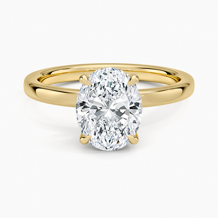 Oval moissanite classic four claw plain band ring in yellow gold, top view