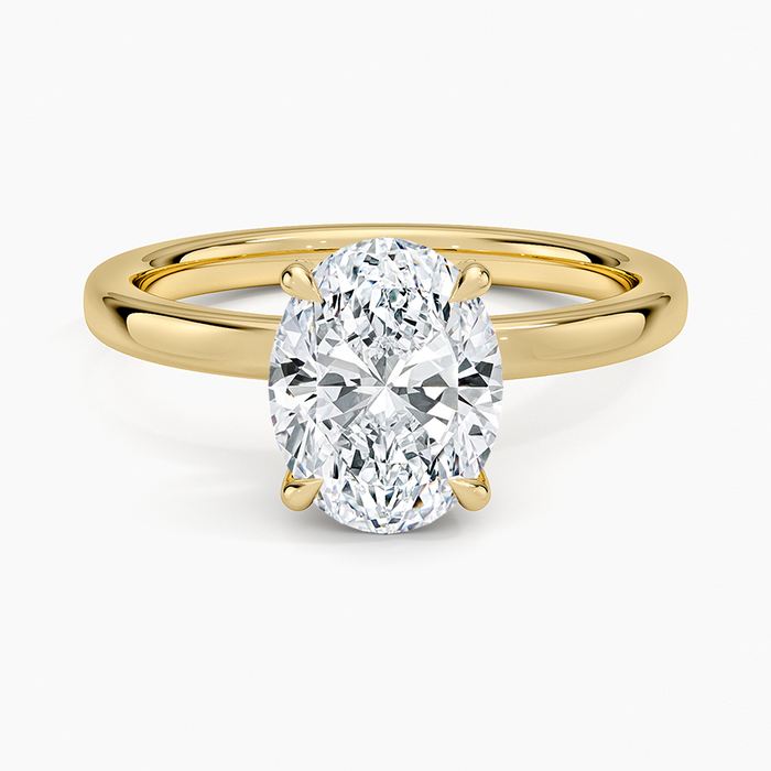 Oval moissanite classic four claw plain band ring in yellow gold, top view
