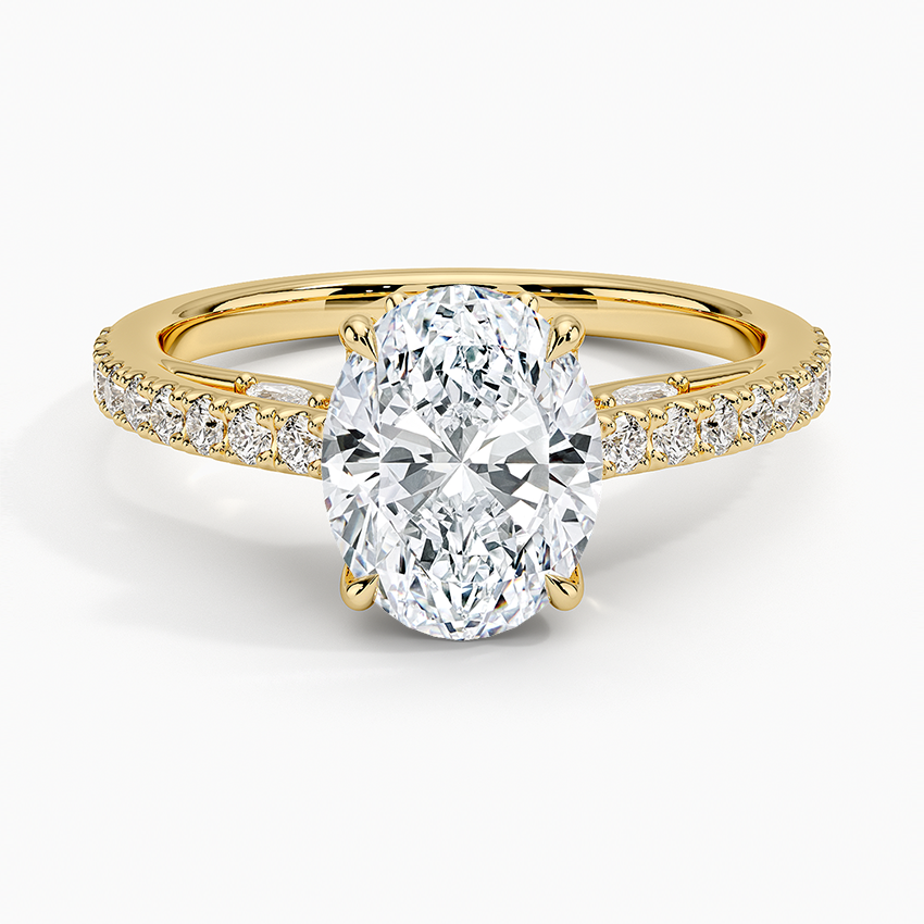 Oval moissanite with bead set pave shoulders in yellow gold, top view