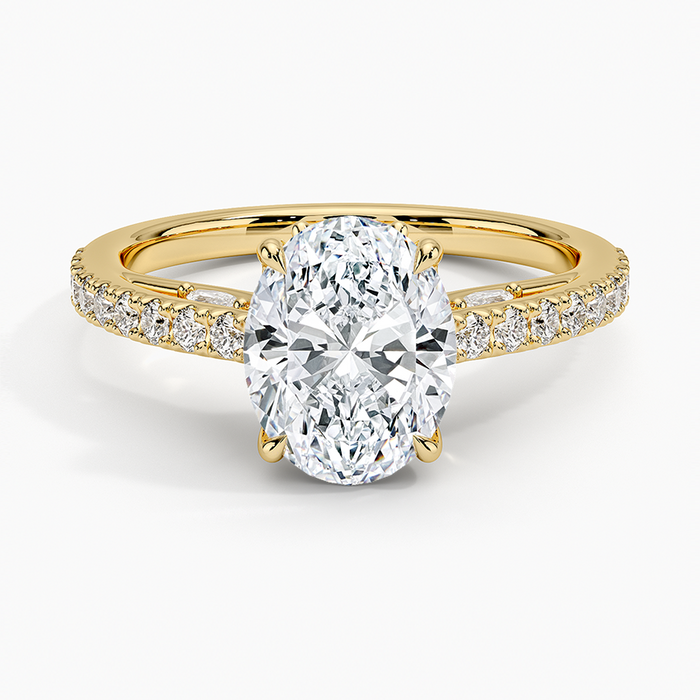 Oval moissanite with bead set pave shoulders in yellow gold, top view