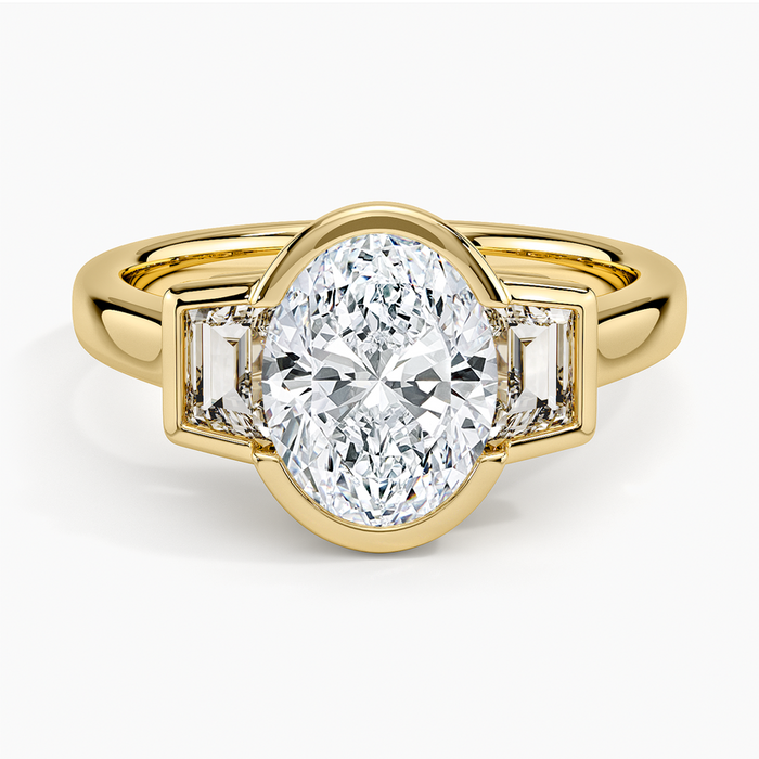 Oval moissanite bezel set between two baguettes in yellow gold, top view