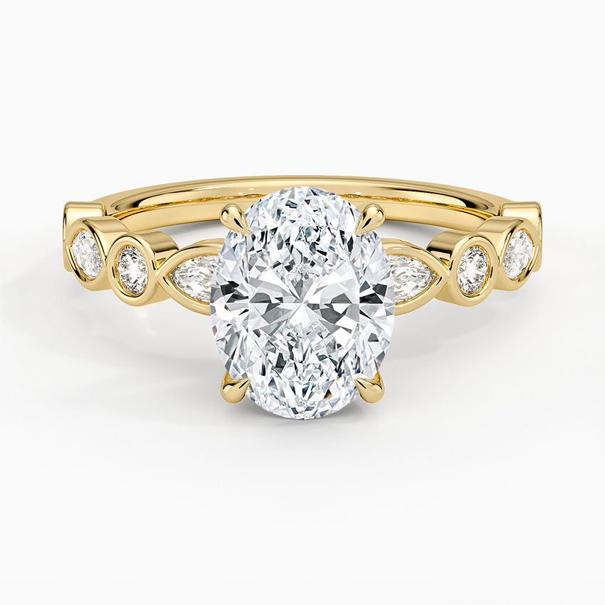 Oval moissanite with bezel set marquise and round accents in yellow gold, top view