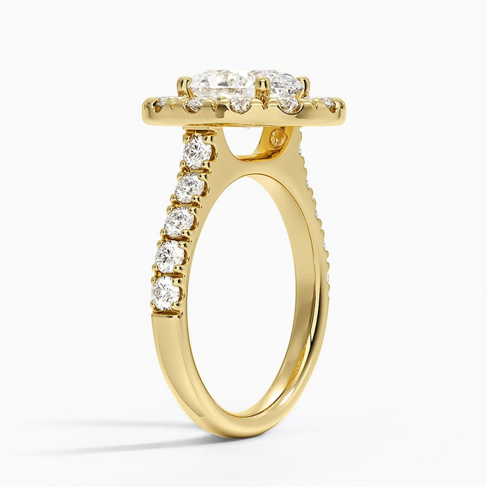 Side view showing the large halo stones in shared prongs