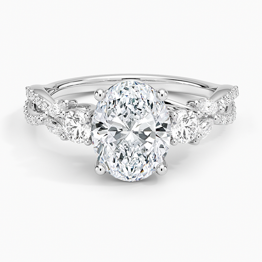 Oval moissanite three stone engagement ring with braided pave vine band in white gold