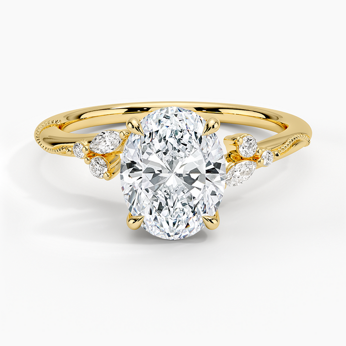 Oval moissanite branch band ring with scattered accents in yellow gold, top view
