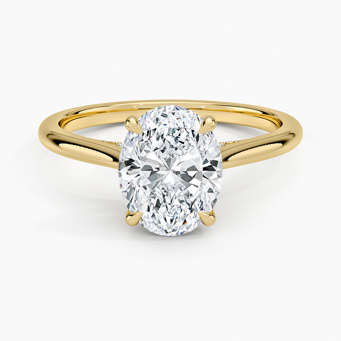 Oval moissanite cathedral hidden halo engagement ring in yellow gold, top view