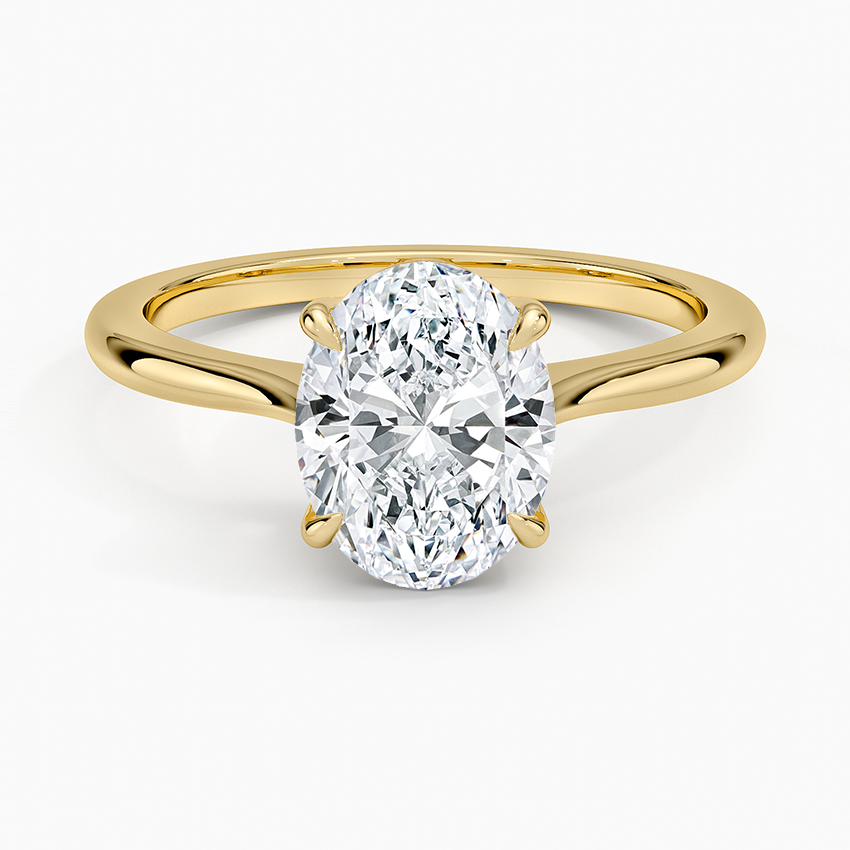 Oval moissanite cathedral solitaire in yellow gold, top view
