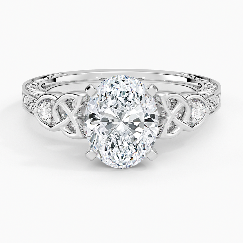 Oval moissanite with pierced Celtic knot shoulders in white gold, top view