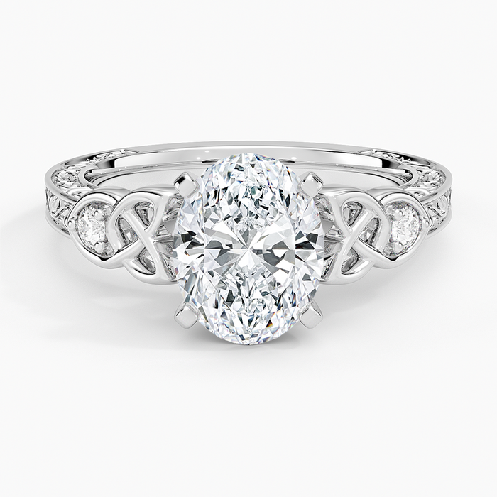Oval moissanite with pierced Celtic knot shoulders in white gold, top view