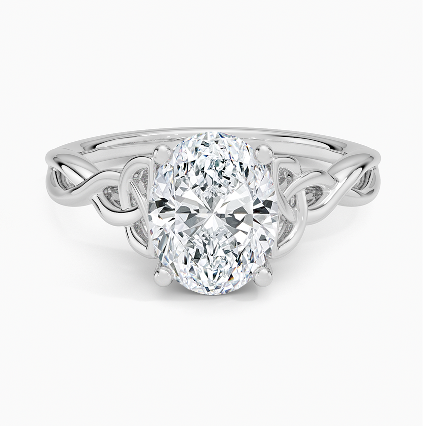 Oval moissanite solitaire on a woven Celtic knot band in white gold, top view