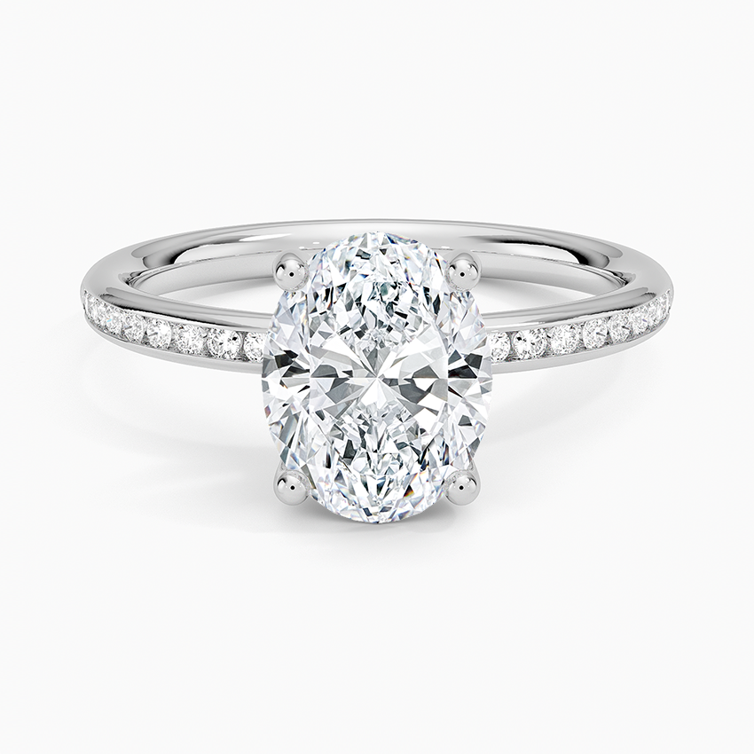 Oval moissanite on a channel set flat band in white gold, top view
