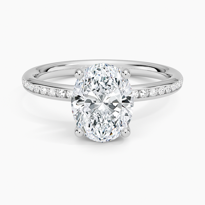 Oval moissanite on a channel set flat band in white gold, top view