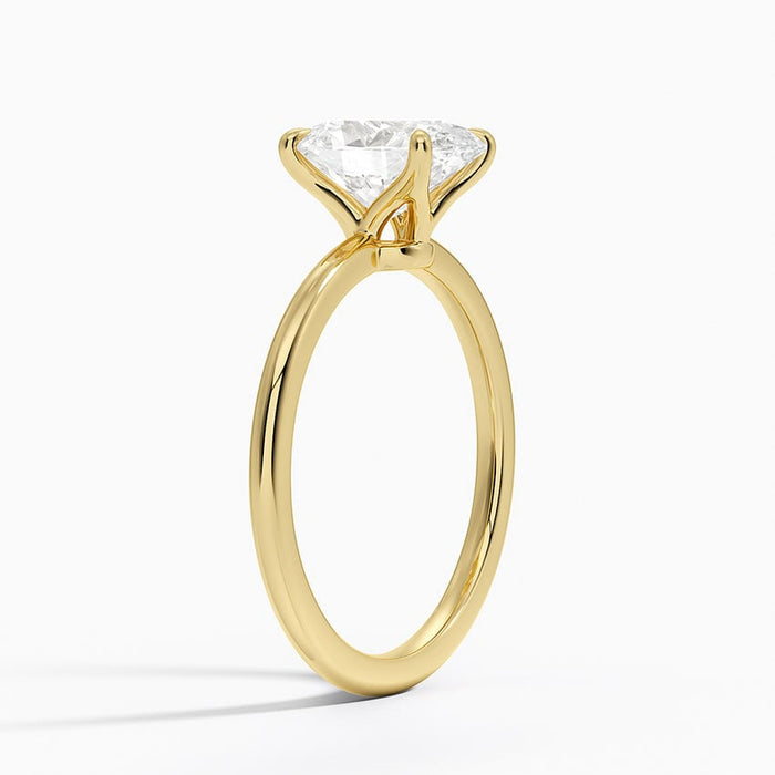Side profile of oval moissanite solitaire showing open gallery and slim band