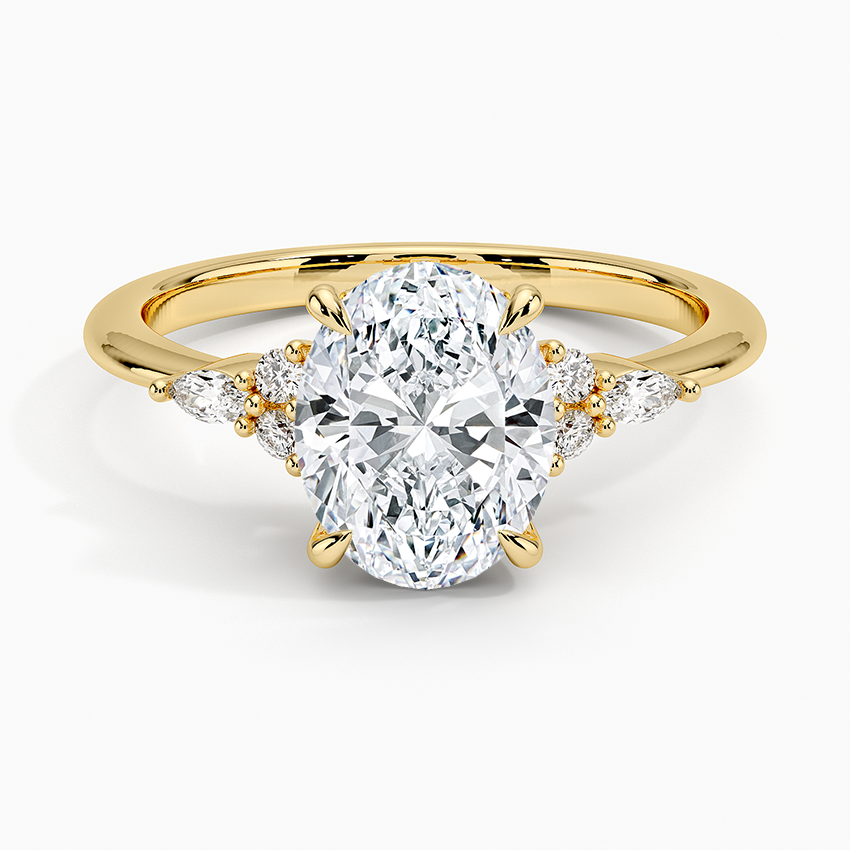 Oval moissanite cluster accent solitaire engagement ring in yellow gold, front view